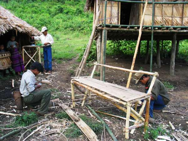 Constructing seating and a desk for the ethnographer. These deteriorated by the end of his stay in the village.