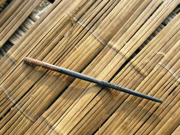 Mixing-stick for evening out hot rice before serving.