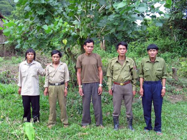 Nakai District official (centre) with Kri village administration and militia representatives, on a break from a working meeting.