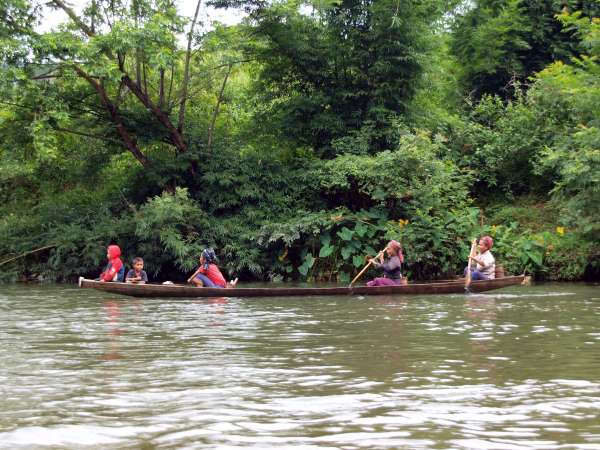 Family members on an early morning commute to their swiddens.